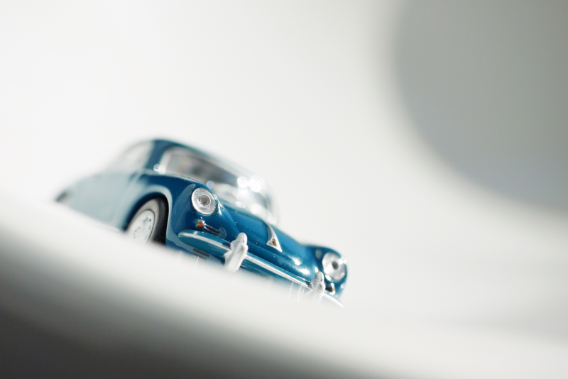 Illustration for article titled Kyosho Porsche 1 1/64 #84 - Projekt RennSport Käfer #2 - 1965 Porsche 356 C Coupe